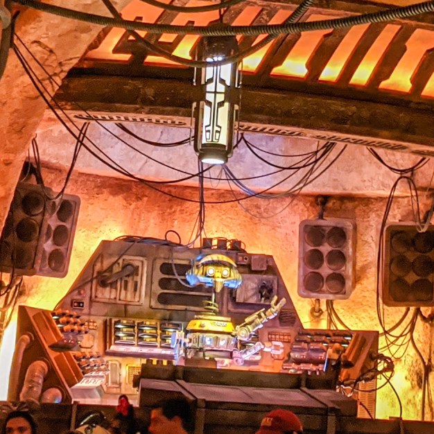 The robot DJ pumps up the crowd at Oga's Cantina